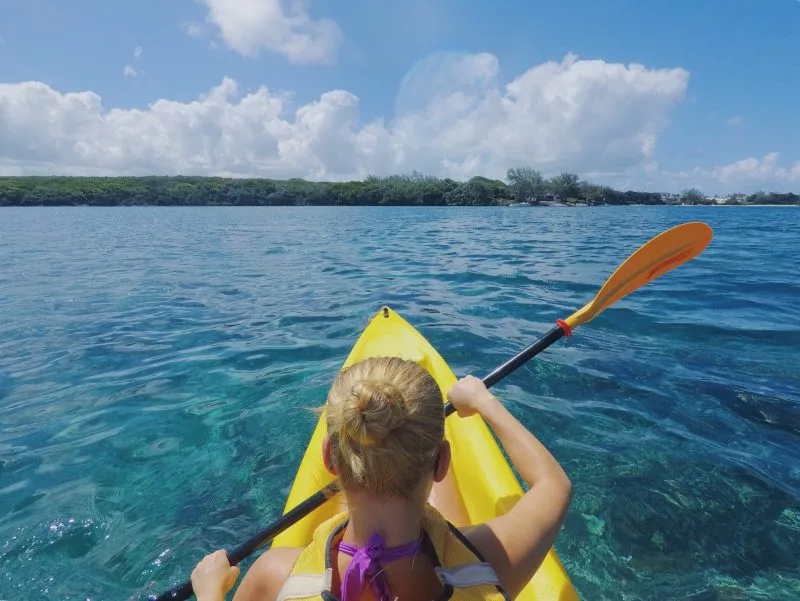 Woman kayaking in a river